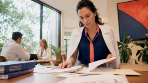 Healthcare professional reviewing regenerative therapy files