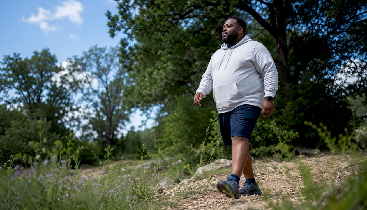 Man walking outdoors for joint health